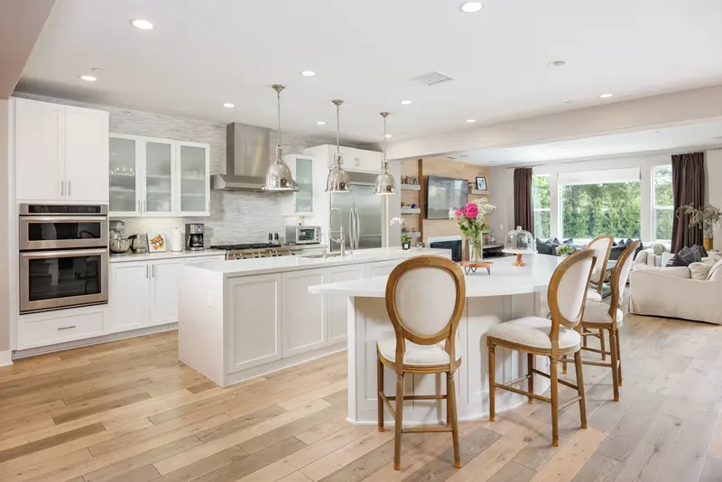 Kitchen with white cabinetry and mosaic tile backsplash — Aliso Viejo real estate photography