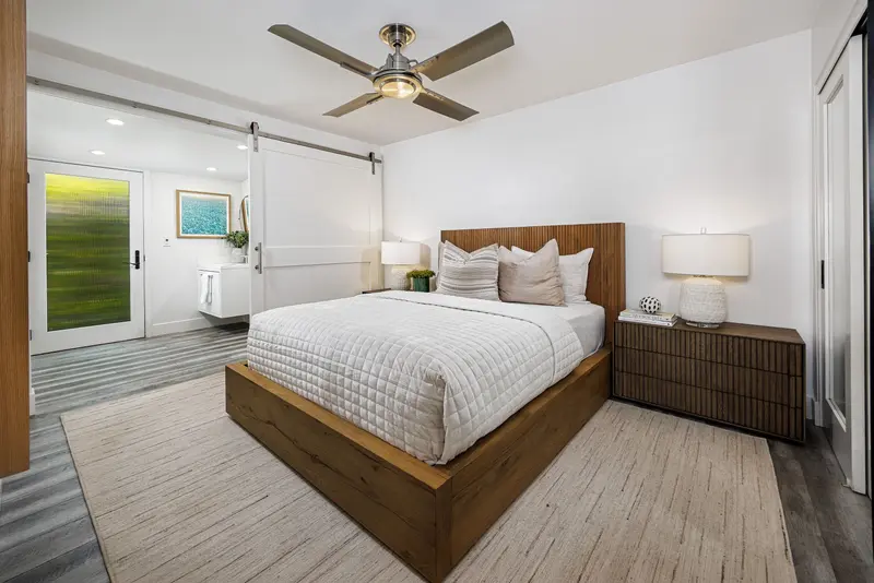 Guest bedroom with barn-door bath access — Corona del Mar real estate photography