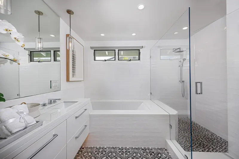 Primary bathroom soaking tub and walk-in shower — Corona del Mar real estate photography