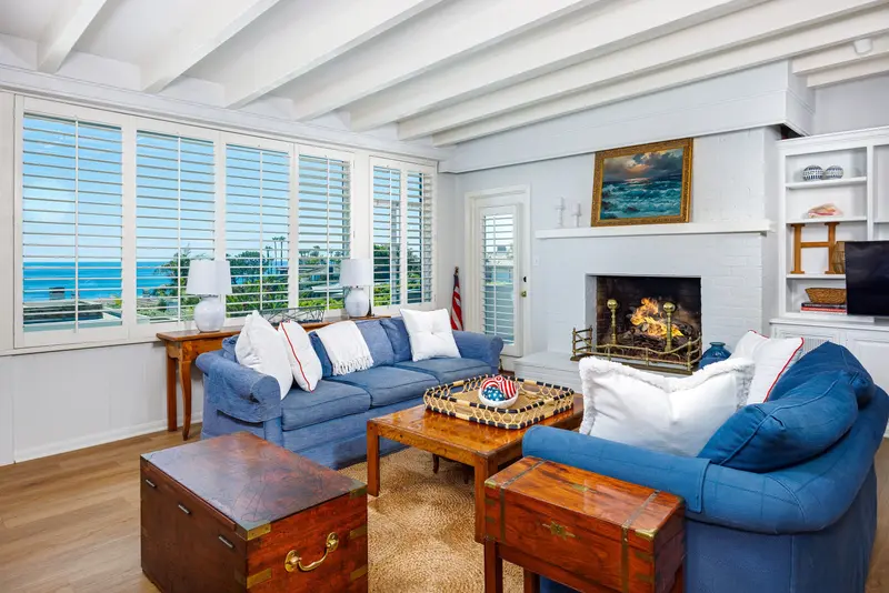 Family room with white brick fireplace — Laguna Beach real estate photography
