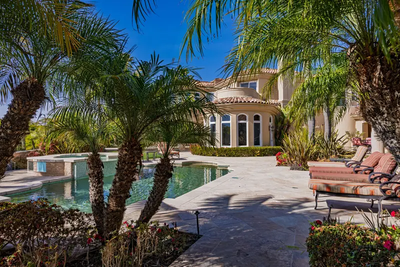 Backyard pool framed by palm trees — Laguna Niguel real estate photography