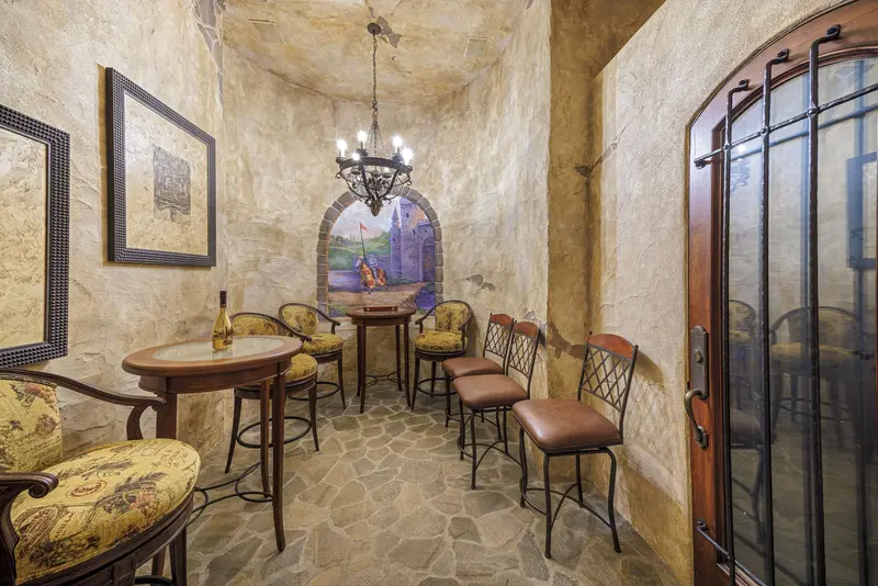 Medieval-themed wine cellar with castle mural — Laguna Niguel real estate photography