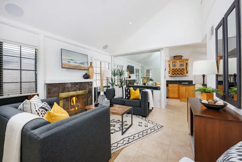 Living room with fireplace and vaulted ceiling — Lake Forest real estate photography