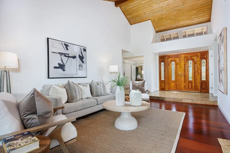 Vaulted wood-ceiling entry opening into the living room — Mission Viejo real estate photography