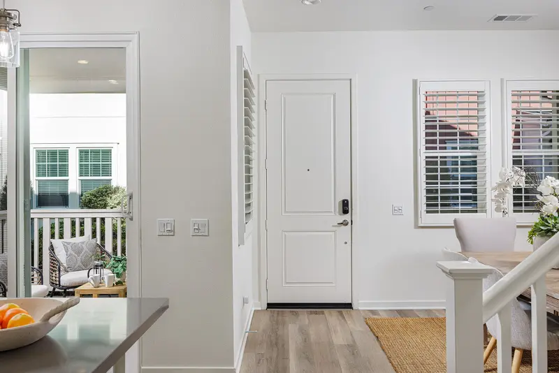 Entry hallway with staircase and dining room beyond — Rancho Mission Viejo real estate photography