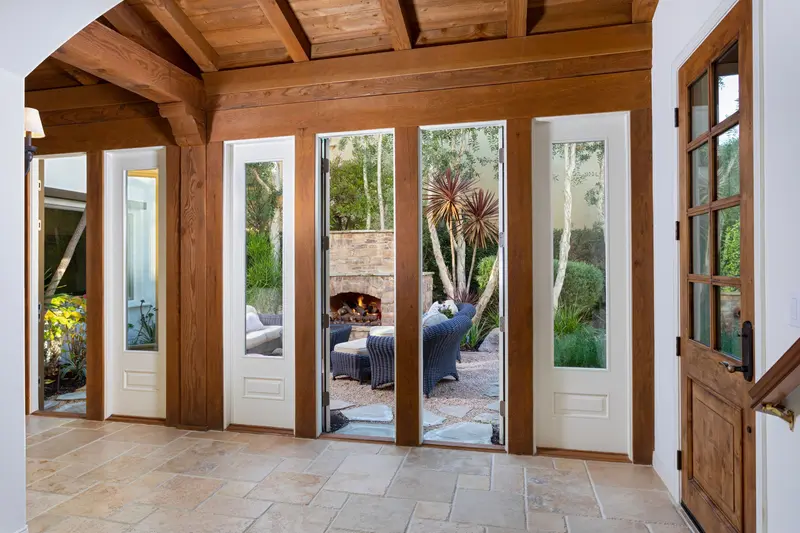 Courtyard entry with outdoor fireplace beyond — San Clemente real estate photography