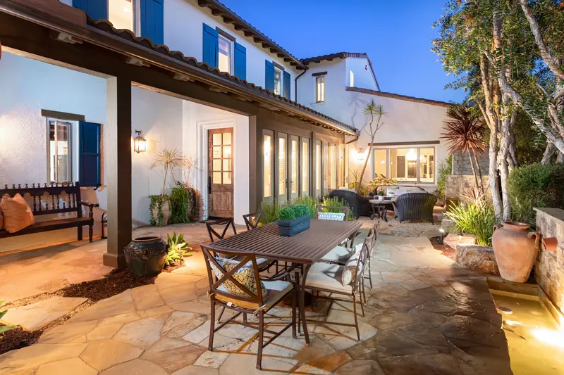 Courtyard dining and lounge area at twilight — San Clemente real estate photography