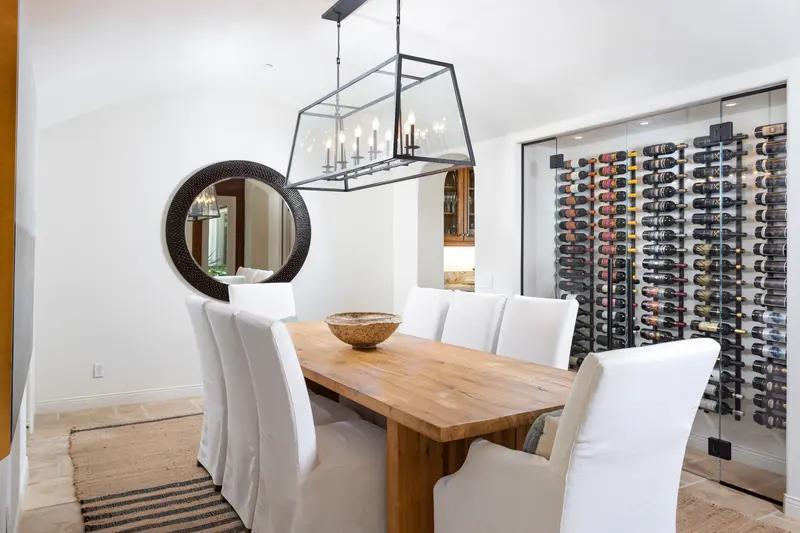 Dining room with glass-walled wine display — San Clemente real estate photography