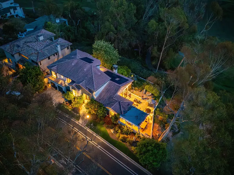 Aerial view at twilight with the home lit up — San Juan Capistrano real estate photography