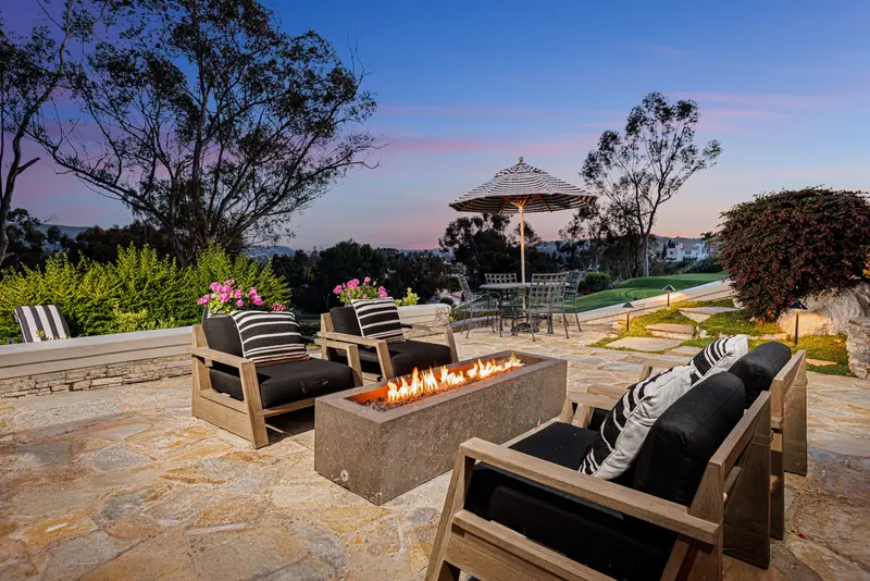 Firepit lounge at twilight with golf course view — San Juan Capistrano real estate photography