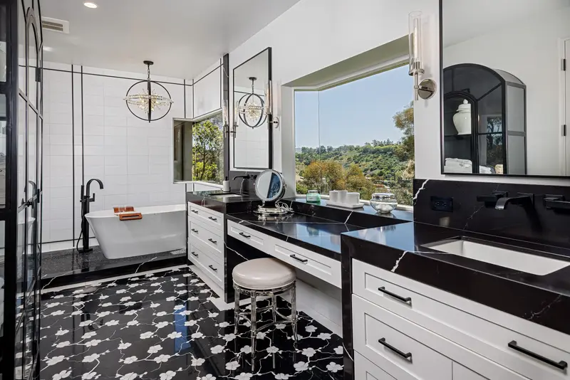 Primary bathroom with black marble and patterned floor — San Juan Capistrano real estate photography