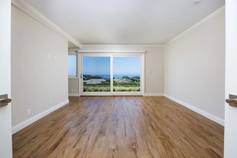Primary bedroom virtually staged with coastal decor — Orange County, CA real estate photography